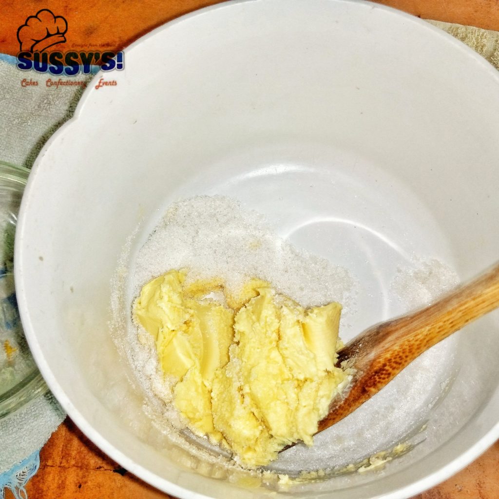Butter and sugar in mixing bowl 